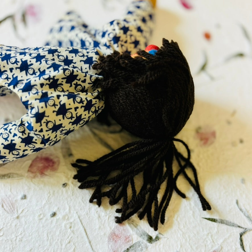 Vintage Doll with Ponytail in a Blue Dress